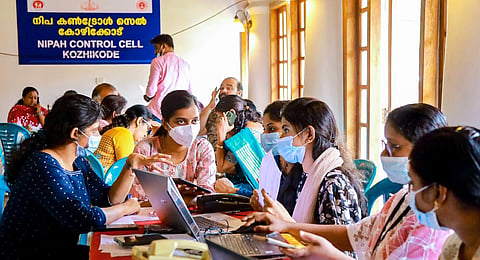 Health workers at a control room set up amid Nipah virus outbreak in Kerala, in Kozhikode, Thursday, Sept. 14, 2023. (Photo | PTI)