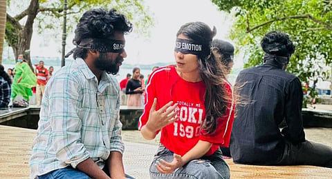 Participants are blindfolded as part of 'silenced emotions' and paired with another person, allowing them to engage in open, judgement-free conversations. (Photo | Express)