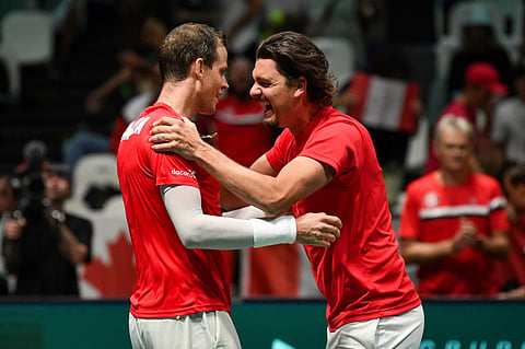 Canada's Frank Dancevic (right) congratulates Canada's Vasek Pospisil after he defeated Sweden's Leo Borg during their Davis Cup group stage tennis match. (Photo | AP)
