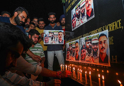 Tributes being paid to Col Manpreet Singh, Major Ashish Dhonchak and DSP Humayun Bhat who were killed in Anantnag. Photo of Rifleman Ravi Kumar killed in Rajouri is seen too. (PTI)