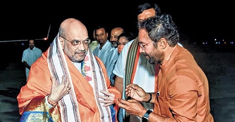 BJP State president G Kishan Reddy receives Union Home Minister and saffron party senior leader Amit Shah at the RGI Airport in Hyderabad on Saturday