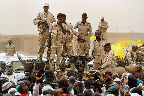 Sudanese soldiers from the Rapid Support Forces unit stand on their vehicle during a military-backed rally, in Mayo district, south of Khartoum, Sudan. (File photo | AP)