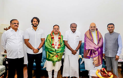 Union Home Minister Amit Shah and BJP National President JP Nadda with former Karnataka chief minister H.D. Kumaraswamy during a meeting in New Delhi (Photo | PTI)