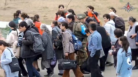 Ethnic Armenians arrive at a Russian peacekeepers' camp near Stepanakert in Nagorno-Karabakh. (AP)