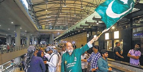 Basheer Chacha waves the Pakistan flag to welcome the team at the Rajiv Gandhi International Airport in Hyderabad on Wednesday | PTI