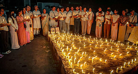 Women take part in a candlelight vigil, in Imphal, against the killing of two missing Meitei students by unknown miscreants, Sept 27, 2023. (Photo | PTI)