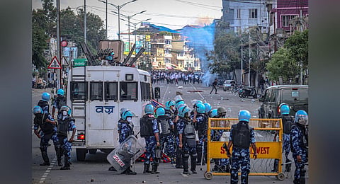 Security personnel fire tear gas, in Imphal, as students protest against the killing of two missing students by unknown miscreants and demand peace in Manipur, Sept 27, 2023. (Photo | AFP)