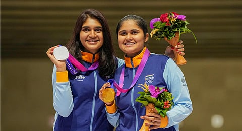 Pistol shooters Esha Singh (L) & Palak celebrate their 1-2 finish on Friday. (Photo | PTI)