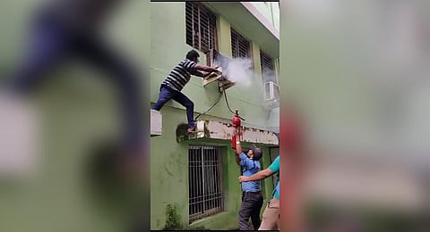 Hospital staff and fire personnel try to douse the fire at the MCH  | Express