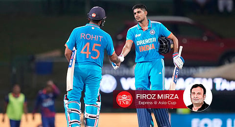Rohit Sharma shakes hands with Shubman Gill as they celebrate their 10 wickets win in the Asia Cup cricket match between India and Nepal. (Photo | AP)