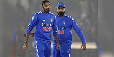 India's Axar Patel celebrates with captain Rohit Sharma the wicket of Afghanistan's batter Rahmanullah Gurbaz during the first T20I cricket match between India and Afghanistan, in Mohali (Photo  |PTI)