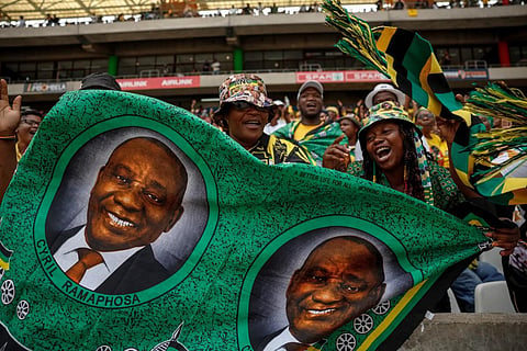 African National Congress (ANC) supporters hold a fabric with a picture of South African President Cyril Ramaphosa during a rally in Mbombela on January 13, 2024. (Photo | AFP)