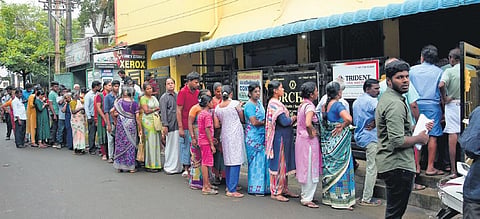 People seen queuing up to get the application form to receive the cyclone relief at Chrompet in Chennai. (File Photo | Ashwin Prasath