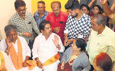 LoP R Ashoka interacts with the family members of Srikant Poojari in Hubballi on Wednesday  | D Hemanth