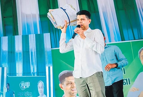 VK Pandian showing the petitions received during the public meeting. (Photo | Express)