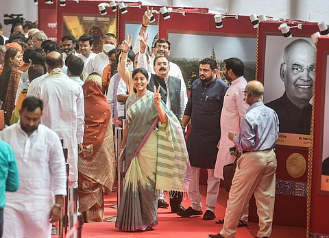 Union Minister Anupriya Patel flashes victory sign after casting her vote for the election of the President, at Parliament House in New Delhi, Monday, July 18, 2022.  (Photo | PTI)