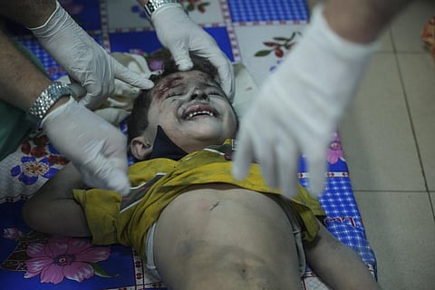 Palestinian child wounded in Israeli bombardment under treatment at a hospital in Gaza (Photo | AP)