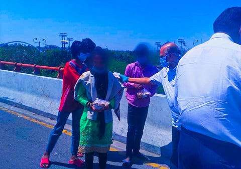 Justice Ravindra Bhat handing out food package