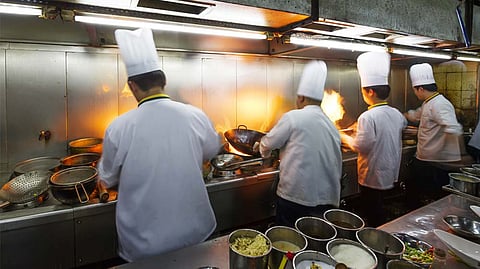 workers in restaurant kitchen