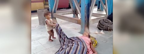 Toddler trying to wake up dead mother 