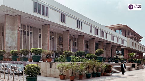 Peeping into public bathroom when woman is bathing offence under IPC even if bathroom has only curtain and no door: Delhi High Court