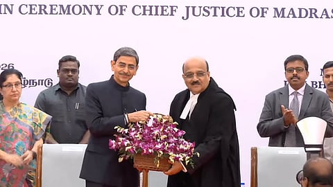 TN Governor RN Ravi (L) felicitates Chief Justice SA Dharmadhikari (R) at the swearing-in ceremony
