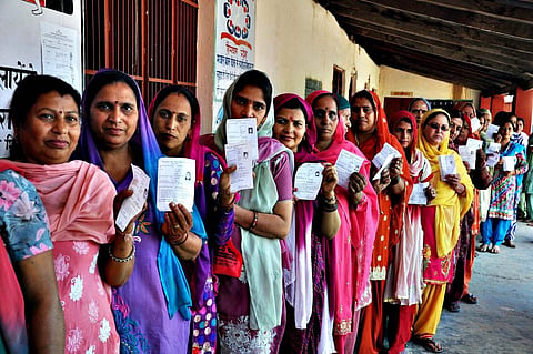 Voting during 8th phase of Parliamentary election...epa04194527 Indian women show their voting slips as they wait to cast their votes at a polling station during the 8th phase of Parliamentary election at Palampur, Himachal Pradesh, India, 07 May 2014. Parliamentary elections in India are being held in nine phases between 07 April and 12 May 2014. A total of 814.6 million people are eligible to vote, around 100 million more than in the elections in 2009.  EPA/SANJAY BAID