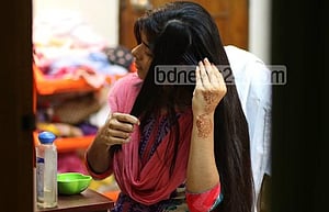 চুলের যত্নে গরম তেল
