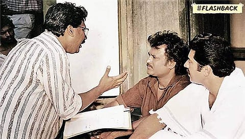 Mani Ratnam is seen explaining a scene to Rajinikanth, even as Mammootty oversees the conversation