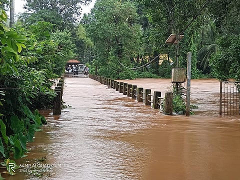 A bridge submerged by overflowing river in Paroda Village of Goa