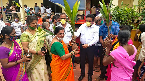 MLA Sopte while distributing the tree at Tuem, Goa 
