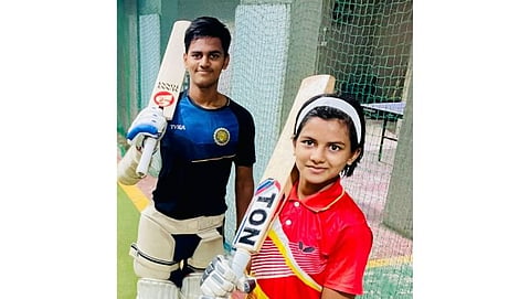 Brother Sister playing cricket 