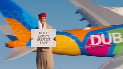 Air hostess take risk of standing on Burj Khalifa building at risk of her life 
