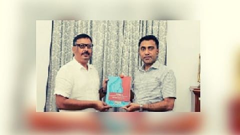 Arun Pandey presenting a report on human trafficking in Goa to Chief Minister Pramod Sawant.