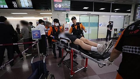 A man has been arrested for opening the emergency door of an Asiana Airlines flight as it was landing in South Korea.