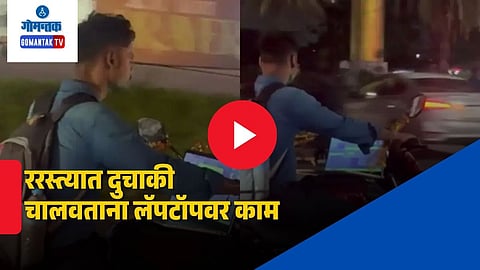 Man working on laptop on bike