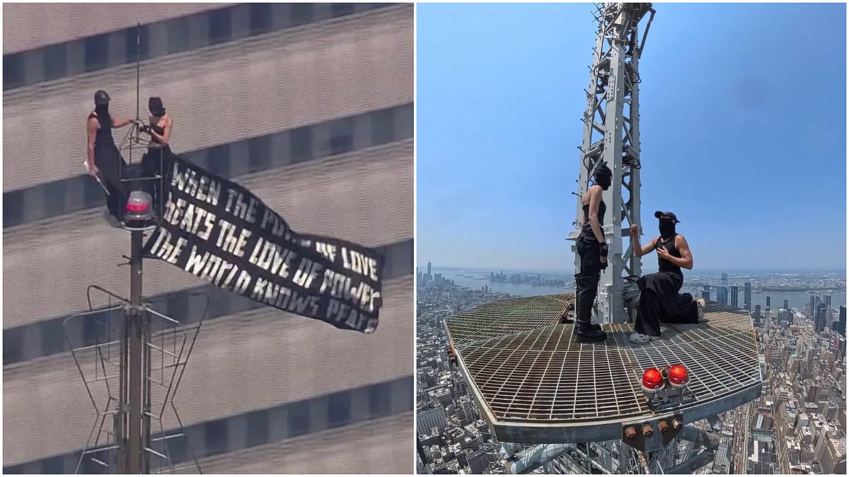 Russian couple arrested after staging Empire State Building proposal, hanging banner about 'the power of love' on antenna