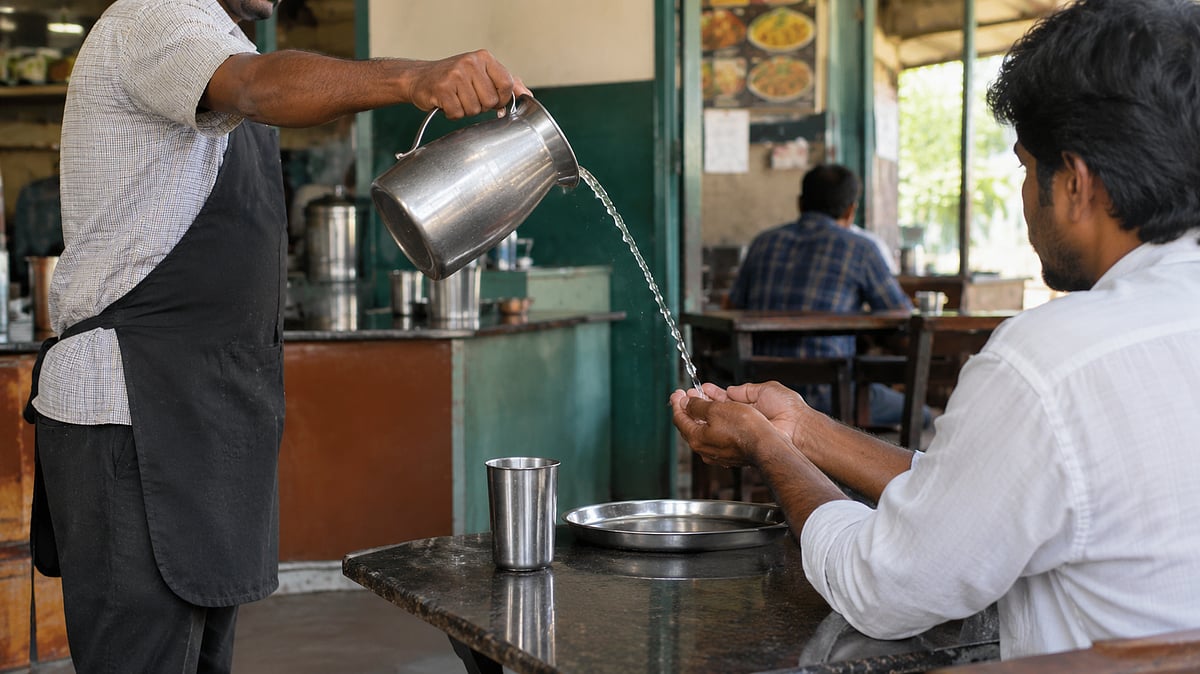 Karnataka | Water poured into palms from a distance: Untouchability case filed against eatery owner