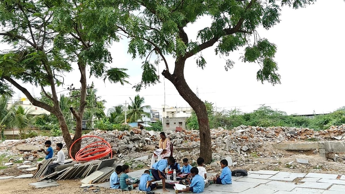 Students brave sun, snakes to attend classes under tree