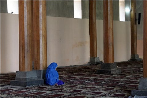 A Kashmiri woman prays inside the historic Jamia Masjid in Srinagar. According to the survey, women in the Valley are more afflicted by mental distress than men    Credit: Flickr