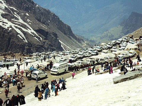 Tourists wait for a ride on Rohtang Pass after the
National Green Tribunal limited the number of petrol
and diesel vehicles that can ply the eco-sensitive area (Photo: Aman Gupta)