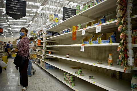 Venezuela’s illegal traders have proliferated as grocery stores are fast becoming empty Credit: Eneas De Troya / Flicker