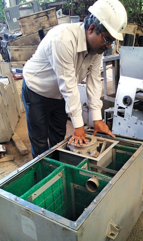 An engineer from
the Indian Railways
inspects a bio-toilet (Photo: Chhavi Sachdev)