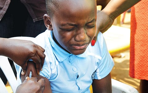 A child being vaccinated during
an emergency campaign
against yellow fever in Congo's
capital Kinshasa (Photo: Reuters)