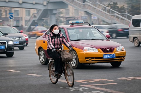 The poor quality of air in China's cities forces citizens to resorts to emergency measures such as masks (Credit: iStock) 