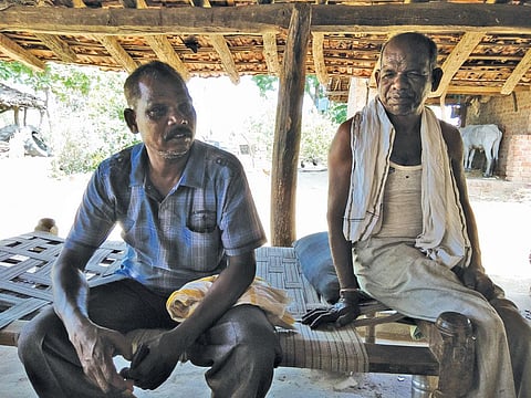 Pandu Singh Marshkole (seated on the right), a Gond tribal of Betul's Dolhara village, says about 200 families in the village want pattas for the land they have lived on for decades.  (Photos: Jitendra)