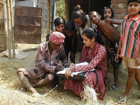 Credit: University of Salford researcher Priya Mondal conducting a major research project that identified millions of people at risk of serious genetic damage from arsenic absorbed by rice in India in 2013  Credit: Flickr
