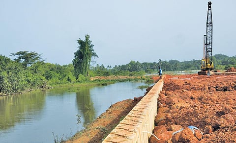 Road construction projects are destroying Goa's traditional wetlands and lakes.Construction on Rumder lake in Nuvem village near Margao is filling the waterbody with mud and concrete (Photographs: Arnab Pratim Dutta)