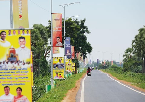 The road to the proposed Andhra Pradesh capital of Amaravati is lined with posters that claim it is a city of hope. But displaced farmers tell a different story (Photo: Vikas Choudhary)