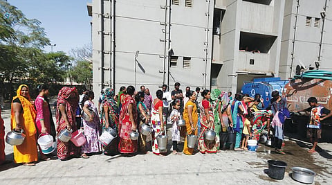 Tankers are the main source of water for many households in Gujarat, like these women collecting their daily quota on the outskirts of Ahmedabad (Photo: Photographs: Amit Dave)